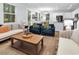 Open-concept living room and kitchen area with neutral tones and plenty of seating at 4698 Cloisters Ln., Myrtle Beach, SC 29577