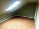 Bedroom with skylight, wood-look floors, and fresh paint at 500 Fairway Village Dr. # 6E, Myrtle Beach, SC 29588