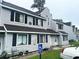 Exterior of property with gray siding, black shutters, and handicap parking spot at 500 Fairway Village Dr. # 6E, Myrtle Beach, SC 29588