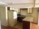 Traditional kitchen featuring white appliances and plenty of cabinets, providing ample storage space at 500 Fairway Village Dr. # 6E, Myrtle Beach, SC 29588