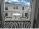 Charming balcony setup with seating and a view at 5000 N Ocean Blvd. # F2, North Myrtle Beach, SC 29582