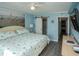 Bright bedroom shows attached bathroom, light blue walls and beach themed decor at 5000 N Ocean Blvd. # F2, North Myrtle Beach, SC 29582