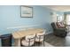 Comfortable dining and living space featuring a wooden table with seating and a large, comfortable couch at 5000 N Ocean Blvd. # F2, North Myrtle Beach, SC 29582