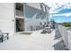 Spacious outdoor deck features a table with chairs and gray-washed floorboards at 5000 N Ocean Blvd. # F2, North Myrtle Beach, SC 29582