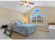 Bedroom with vaulted ceilings, white metal bed frame, large window and an attached desk at 509 Fallen Leaf Ct., Myrtle Beach, SC 29588