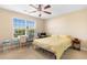 Neutral bedroom featuring a ceiling fan, double window and tan carpet at 509 Fallen Leaf Ct., Myrtle Beach, SC 29588