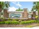 Beautiful brick entrance sign for Forestbrook Preserve, complemented by lush landscaping and mature palm trees at 509 Fallen Leaf Ct., Myrtle Beach, SC 29588