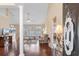 Inviting entryway showcasing wood floors, a decorative column, and a view of the living area at 509 Fallen Leaf Ct., Myrtle Beach, SC 29588