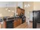 Well-equipped kitchen featuring wooden cabinets, granite countertops, and a full appliance suite at 509 Fallen Leaf Ct., Myrtle Beach, SC 29588