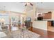 Open concept living area with wood floors, ample seating, and view of the dining area at 509 Fallen Leaf Ct., Myrtle Beach, SC 29588
