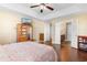 Comfortable primary bedroom with hardwood floors, a tray ceiling, and an ensuite bathroom at 509 Fallen Leaf Ct., Myrtle Beach, SC 29588