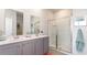Clean bathroom featuring double sinks, modern fixtures, and a glass-enclosed shower at 5140 Yellowstone Dr., Conway, SC 29526