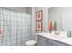 Well-lit bathroom featuring a vanity with quartz countertop and a shower with a curtain at 5140 Yellowstone Dr., Conway, SC 29526