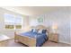 Cozy bedroom with blue accents, a patterned wall, and ample natural light at 5140 Yellowstone Dr., Conway, SC 29526