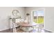 Cozy dining area with a wooden table, seating for four, and a bright window view at 5140 Yellowstone Dr., Conway, SC 29526
