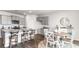 Open-concept kitchen featuring stainless appliances and a dining area with a round table at 5140 Yellowstone Dr., Conway, SC 29526