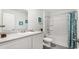 A clean white bathroom features a tub with shower and coordinated decor at 5153 Yellowstone Dr., Conway, SC 29526