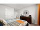 Well-decorated bedroom with dark wooden dresser, stylish decor, and a bright color scheme at 5153 Yellowstone Dr., Conway, SC 29526