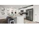 Modern kitchen with white cabinets, stainless steel appliances, and countertop seating at 5153 Yellowstone Dr., Conway, SC 29526