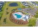Aerial view of a pool, playground, tennis court, pond, parking and houses, all in a neighborhood at 5371 Knobcone Loop # D, Myrtle Beach, SC 29577