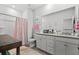 Bright bathroom features a double sink vanity, shower with tub, and cute decorations on the walls and counter at 5371 Knobcone Loop # D, Myrtle Beach, SC 29577