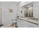 Bathroom with granite countertops, double sinks, a framed mirror, a toilet and a walk in shower with glass door at 5371 Knobcone Loop # D, Myrtle Beach, SC 29577