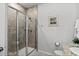 Bathroom featuring a walk-in shower with tiled walls and floor, and a shower head, toilet and granite countertop sink at 5371 Knobcone Loop # D, Myrtle Beach, SC 29577