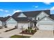 Charming townhomes feature attached garages, well-manicured landscaping and neutral exterior paint at 5371 Knobcone Loop # D, Myrtle Beach, SC 29577