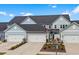 Attractive townhomes offer attached garages and lovely landscaping for a welcoming curb appeal at 5371 Knobcone Loop # D, Myrtle Beach, SC 29577