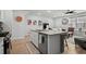 Bright kitchen with granite countertops, stainless steel appliances, and an open layout flowing into the living area at 5371 Knobcone Loop # D, Myrtle Beach, SC 29577