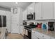 Stylish kitchen with stainless appliances, white cabinets, and light countertops at 5371 Knobcone Loop # D, Myrtle Beach, SC 29577