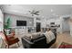 Open-concept living room featuring a modern ceiling fan, gray walls and open access to the kitchen at 5371 Knobcone Loop # D, Myrtle Beach, SC 29577