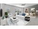 Elegant living room featuring a white sofa set, blue-and-white pillows and carpet, and a well lit office area at 5371 Knobcone Loop # D, Myrtle Beach, SC 29577