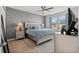 Spacious main bedroom featuring a king-size bed, ceiling fan, and large window offering ample natural light at 5371 Knobcone Loop # D, Myrtle Beach, SC 29577