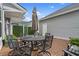 Inviting patio area features an outdoor dining set with privacy fence and wood-look flooring at 5371 Knobcone Loop # D, Myrtle Beach, SC 29577