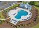 A kidney-shaped pool surrounded by lounge chairs offers a relaxing and luxurious experience at 5371 Knobcone Loop # D, Myrtle Beach, SC 29577