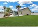 Beautiful backyard featuring a swimming pool, tiki bar, and green lawn, perfect for outdoor gatherings at 561 Irees Way, Longs, SC 29568