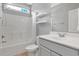 Modern bathroom featuring a bathtub and shower combination, floating shelves, and a sink with vanity at 561 Irees Way, Longs, SC 29568