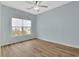 A spacious bedroom with a large window, offering ample natural light and scenic views at 561 Irees Way, Longs, SC 29568
