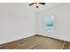 Bright, airy bedroom with ample natural light and wood-look tile flooring for a contemporary aesthetic at 561 Irees Way, Longs, SC 29568