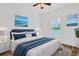 Comfortable bedroom with bright natural light and decorative wall art, ideal for relaxation and rest at 561 Irees Way, Longs, SC 29568