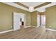 Empty bedroom showcasing a tray ceiling and bright lighting at 561 Irees Way, Longs, SC 29568