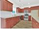 Well-equipped kitchen showcasing stainless steel appliances, granite counters, and ample cabinet space at 561 Irees Way, Longs, SC 29568