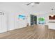 Living room with wood-look tile flooring, and an expansive view of the pool and lanai at 561 Irees Way, Longs, SC 29568