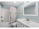 Bright bathroom featuring a shower/tub combo and coastal-themed decor at 6001-308 South Kings Hwy., Myrtle Beach, SC 29575
