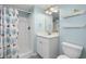 Well-lit bathroom with a white vanity, tiled shower, and modern fixtures at 6001-308 South Kings Hwy., Myrtle Beach, SC 29575