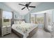 Light and airy bedroom features a decorative seashell-themed quilt and ample natural light at 6001-308 South Kings Hwy., Myrtle Beach, SC 29575