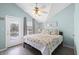 Bright bedroom with beach themed bedding, large windows and patio access at 6001-308 South Kings Hwy., Myrtle Beach, SC 29575