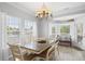 Bright dining room featuring a modern chandelier and views of the waterfront at 6001-308 South Kings Hwy., Myrtle Beach, SC 29575