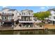 Charming waterfront home featuring multiple decks, offering stunning views and outdoor living spaces at 6001-308 South Kings Hwy., Myrtle Beach, SC 29575